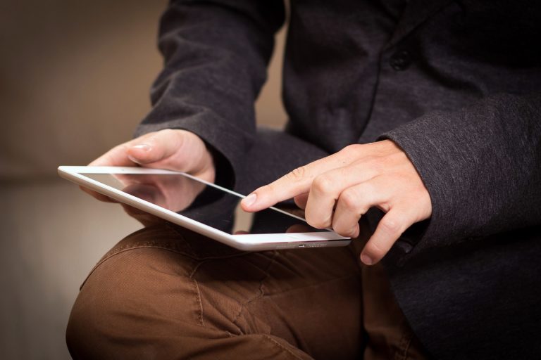 Man using a budget friendly tablet