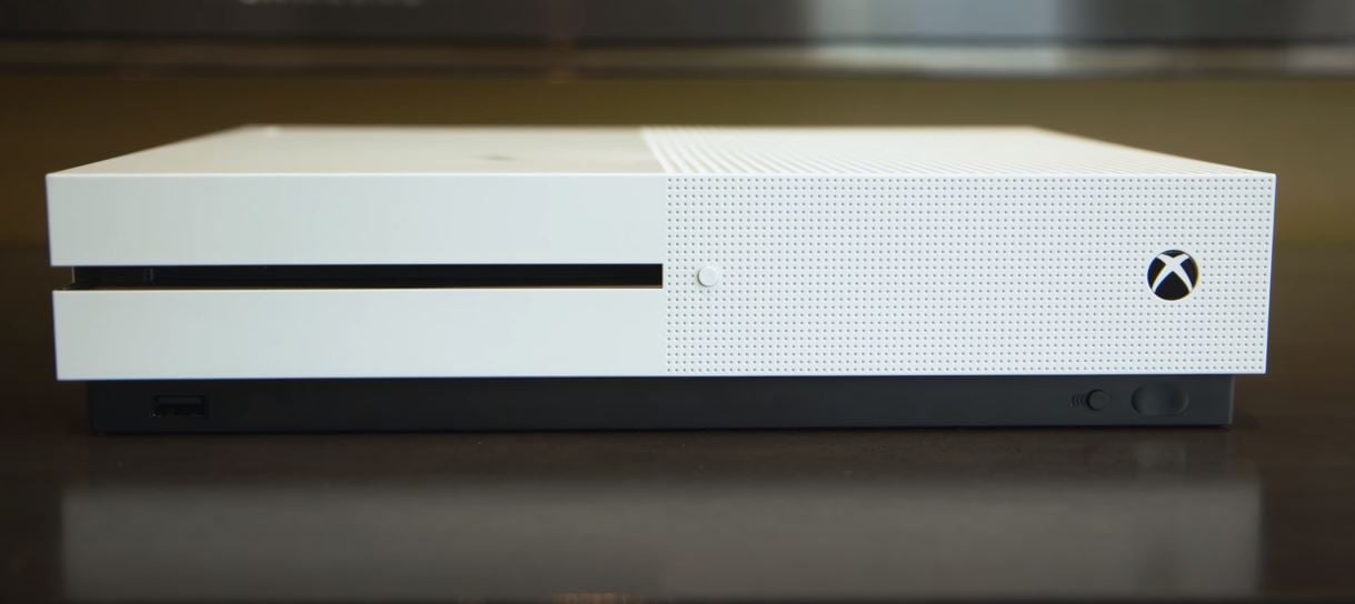 Xbox One S on top of table 1