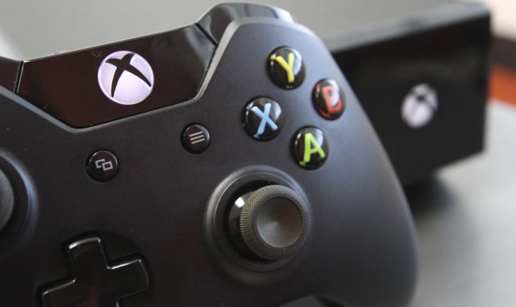 Xbox One controller near console