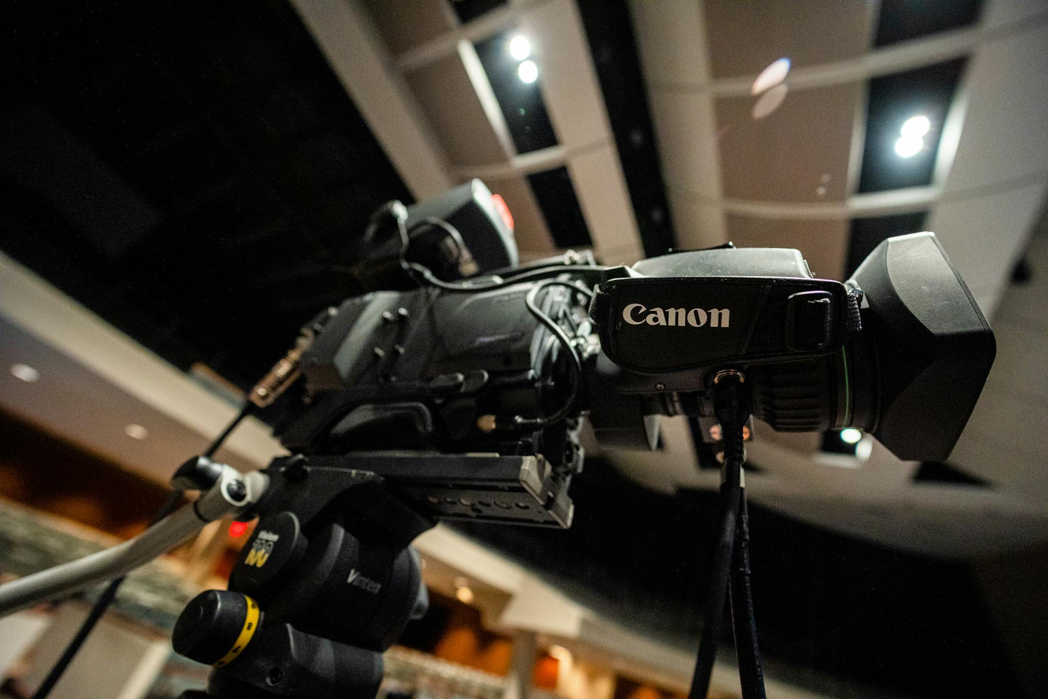 modern digital movie camera placed in recording
